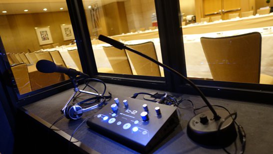 view of an analog interpreter console inside a full isolation interpreter booth