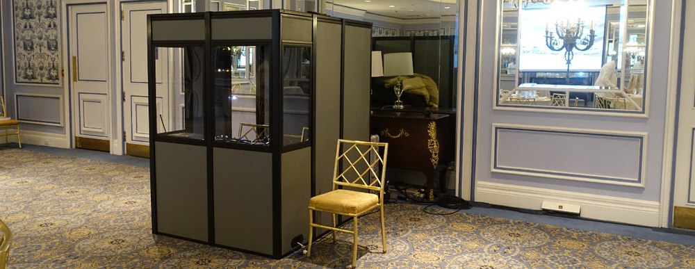 an interpreter booth in a fancy looking meeting room
