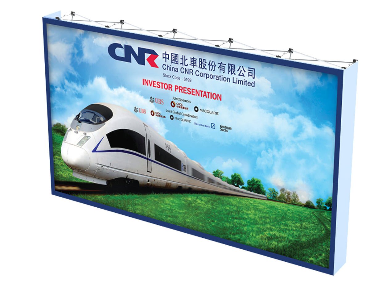 conference backdrop for investor presentation featuring a large train, blue sky and green grass