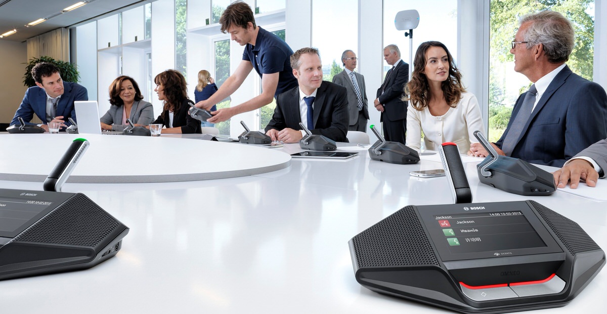 hero image of Dicentis wireless sytem set up in conference room with various people enjoying its use.